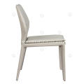 White saddle leather armless dining chairs